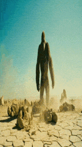 a statue of a gorilla in the desert