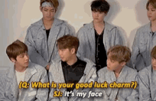 a group of young men are sitting in a room and one of them is asking the other what is their good luck charm
