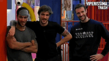 three men are posing for a picture with the words viperissima trash written above them