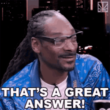 snoop dogg says that 's a great answer while wearing glasses and a bandana