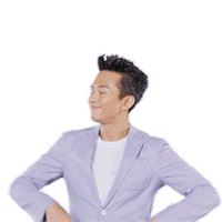 a man in a suit giving the ok sign