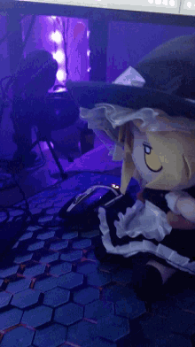 a stuffed animal with a maid outfit is laying on a table