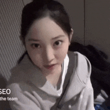 a close up of a woman 's face with the words seo the team visible