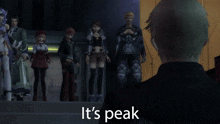 a man stands in front of a group of people with the words it 's peak behind him