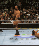 a man in a wrestling ring with the word xfinity on it