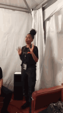 a woman wearing a lanyard with a name tag that says ' t-mobile ' on it