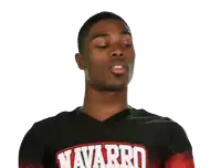 a man wearing a shirt that says navarro on the front