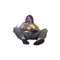 a woman is sitting on the floor with her mouth open and holding a book