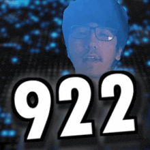 a man with glasses and the number 922