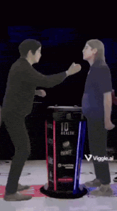 a man is walking up a set of stairs with a viggle sticker on the bottom