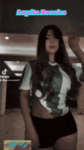 a woman is dancing in front of a sign that says lapita rosales