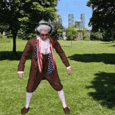 a man in a patriotic costume is standing in a park