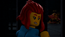 a lego figure with red hair is standing next to another figure