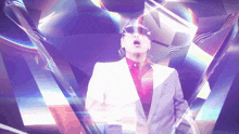 a man in a suit and sunglasses is surrounded by a purple and blue background