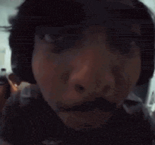 a close up of a man 's face with a beard