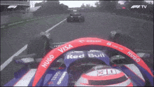 a racing car with the word red bull on it