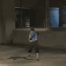 a person is standing in front of a large red object