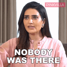 a woman in a pink shirt has the words nobody was there on her face