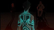 a man with glowing blue lines on his back stands in front of a woman and a man in a wheelchair
