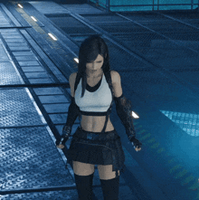 a woman in a white tank top and black skirt is standing on a metal surface