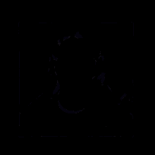 a young man wearing headphones is sitting in front of a computer monitor .