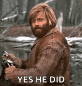 a man with a beard is riding a motorcycle in the woods and saying yes he did .