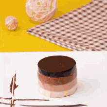 a dessert on a white plate with chocolate shavings on it