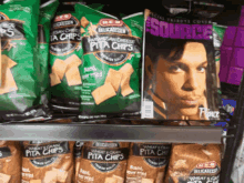 several bags of pita chips are on a shelf