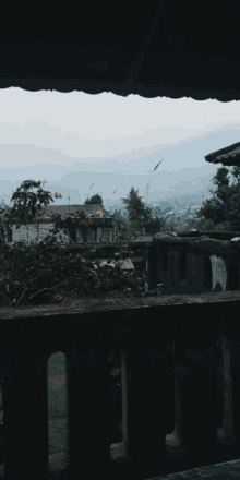 a balcony with a view of a valley and mountains