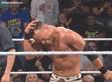 a man in a wrestling ring is wearing a shirt that says i got you on me