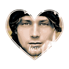 a picture of a man in a heart with the word love written on it
