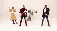 a group of men in costumes are dancing in a row