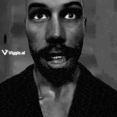 a black and white photo of a man with a beard