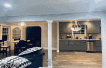 a picture of a living room and kitchen with the words imgflip.com on the bottom right