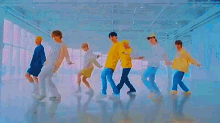 a group of young men are dancing together in a room in a dance studio .
