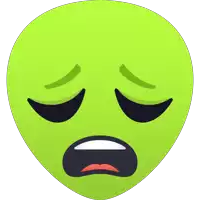 a green alien face with its eyes closed and a sad look on its face