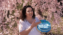 a woman is holding a birthday cake that says happy birthday