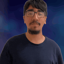 a man wearing glasses and a blue shirt is waving his hand