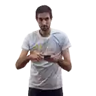 a man wearing a t-shirt that says cofidis looks at his phone