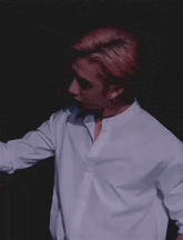 a close up of a person 's hand reaching out towards the camera .