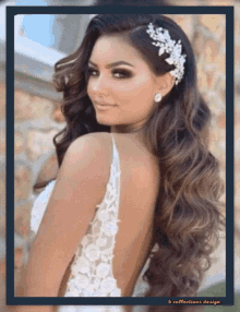 a woman in a wedding dress is wearing a hair accessory .