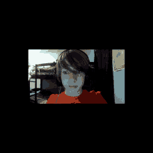 a boy wearing headphones looks at the camera in a dark room