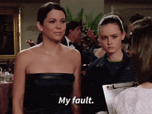 two women are standing next to each other and one of them says " my fault "