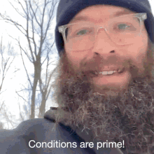 a man with a beard wearing glasses and a black hat says conditions are prime