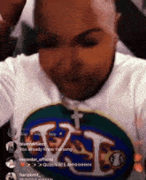 a man wearing a t-shirt that says " queen ate ahhhh " on it