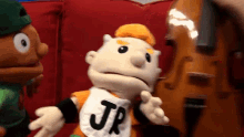 a puppet wearing a shirt that says jr