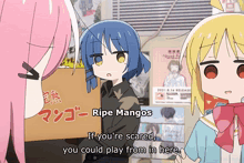 a girl holding a box that says ripe mangoes