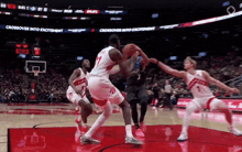 a basketball game is being played in front of a banner that says " crossover into excitement "