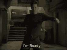 a man says " i 'm ready " in front of a mirror