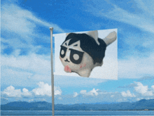 a flag with a picture of a cartoon character with a tongue sticking out
